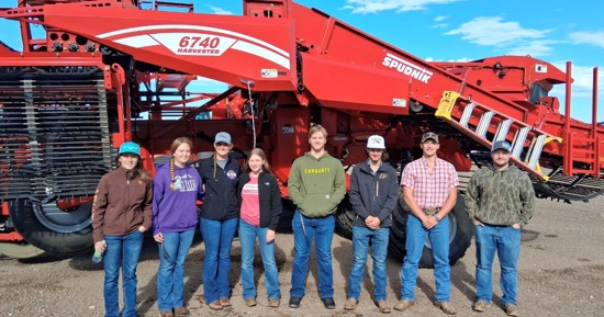From left to right — Wyatt Ozenbaugh of Ohiowa, Nebraska; Aaron Underwood of Esbon, Kansas; Jada Eilert of Jewell, Kansas; Paige Davis of Bartlett, Kansas; Hailey Loutzenhiser of Flagler, Colorado; Mason Semler of Friend, Nebraska; KaCee Jo Saffer of Arriba, Colorado; and Conrad Burrow of Wheatland, Wyoming stand in front of the harvester at Frenchman Valley Produce in Imperial, Nebraska. Their field trip offered a hands-on look at modern potato production, processing, and the region’s vital role in Nebraska agriculture. Photo from Dr. Brad Ramsdale